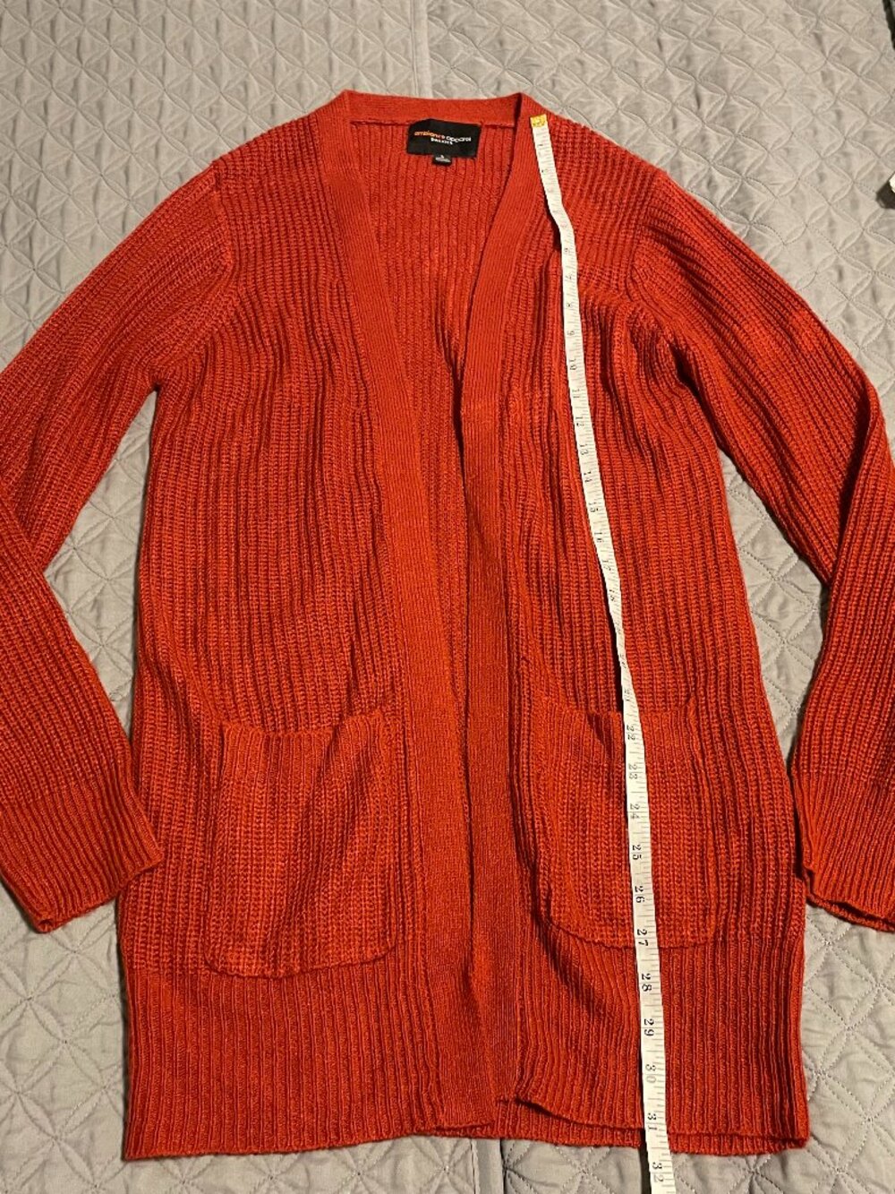 rust-orange open-front knit cardigan